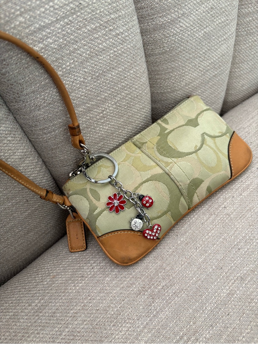 Coach’s Green Optic Y2K Vintage Canvas Wristlet w/ ladybug keychain RARE